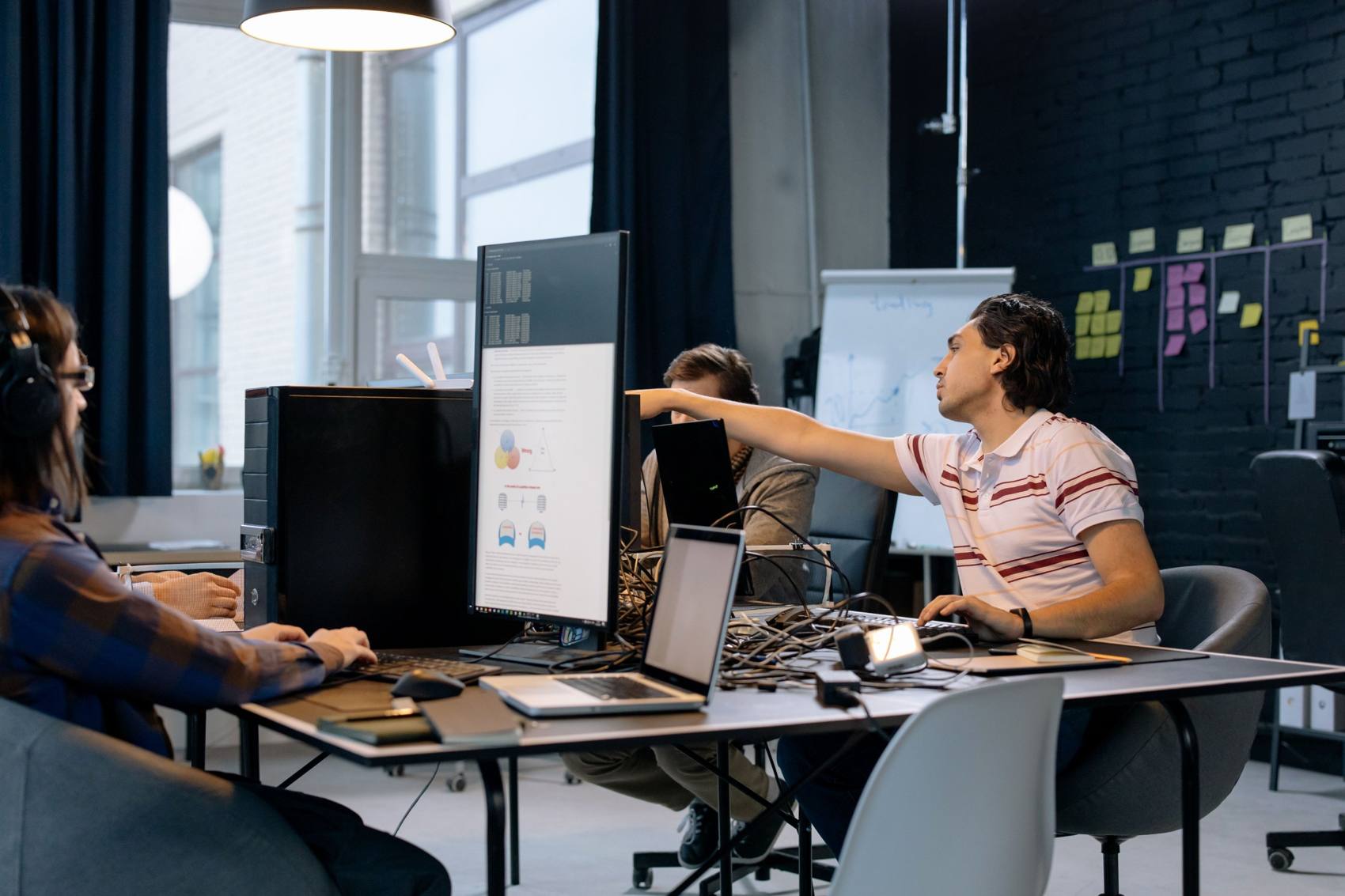 Developers collaborating at a shared desk